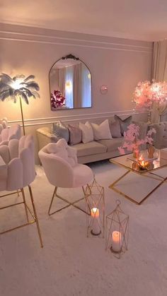 a living room filled with lots of furniture and candles in front of a large mirror