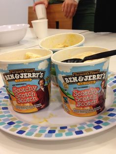 two ice cream cups sitting on top of a plate