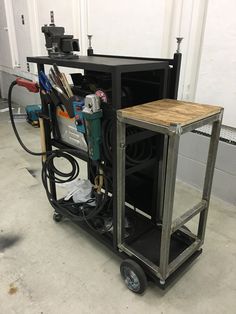 a work cart with tools on it in a garage