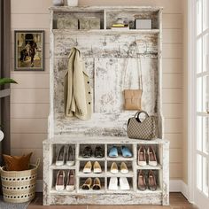 an old wooden bench with shoes and purses on it in front of a window