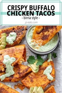 crispy buffalo chicken tacos with guacamole and avocado on top