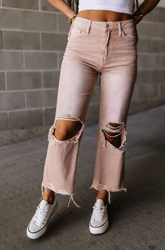 These vintage-style jeans feature heavy distressing, wide-leg 90's style, and a unique tan wash. High waisted Relaxed legs with flare hem Cropped length Heavy distressing at knees and hem Non-stretch denim 100% Cotton Fit and sizing: These jeans run small and do not feature any stretch, we suggest ordering 1-2 sizes up. Front Rise: 11.5" Inseam: 27" See Lily's sizing HERE, she is wearing size 26 See Margie's sizing HERE, she wears size 32 Hippy Fashion, Tan Wash, College Clothes, Hippie Fashion, 90's Style, Dressy Pants, Mama Style, Style Jeans, Cute Jeans