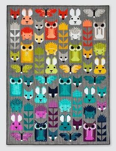 a quilted wall hanging with many different types of animals on it's sides