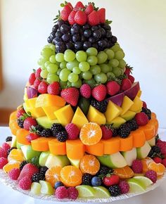 a very large cake made out of fruit