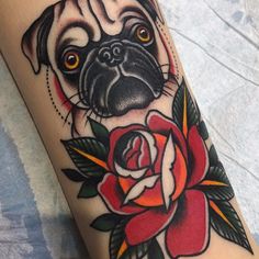 a pug dog with a rose tattoo on its leg is seen in this image