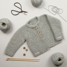 Our Lilly Cardigan Baby Knitting Kit is perfect for adding that extra layer of warmth and softness. Wear the cardigan with a cute baby grow, a dress or with a pair of denim jeans - it's perfect for the colder months to keep your little one warm and cosy. Made with our Beau Baby DK Yarn it's soft and cuddly next to your babies skin. We are proud to be working with a local Yorkshire mill to produce our very own Beau Baby yarn which is used in our baby range kits.  Our Baby Beau yarn is a mixture o Couture, Octopus Knitting, Baby Cardigan Pattern, Baby Sweater Knitting Pattern, Knitting Kit, Baby Jacke, Baby Garments, Baby Grow, Crochet Kit