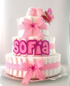 a pink and white cake with the word softa on it