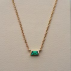 An Absolutely Chic Natural Emerald Solitaire Pendant. It's A Medium-Green, The Perfect Emerald Shade! No Inclusions And Sparkly! This Is A Lively Emerald, Which Is Pretty Difficult To Find In The Baguette Cut. Channel Set Into 14 Karat Yellow Gold. This Necklace Is Adjustable By 3 Sizes! Ranging Between 16 Inches And 18 Inches, Making It Perfect To Wear By Itself Or For Layering Necklaces. (Which Is Very In Style Right Now!) Packaged With A Luxury Gift Box And Complimentary Travel Pouch And Poli Baguette, Emerald Gold Necklace, Time Turner Necklace, Emerald Pendant Necklace, Jewelry Questions, Chic Natural, Origami Necklace, Stackable Necklaces, Emerald Necklace Pendant