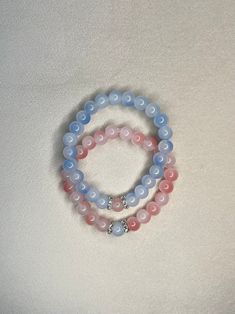 Discover our super pretty couples/friendship bracelets! Adorable pink and blue beaded design accented with pretty silver spacers. Perfect for sharing a touch of charm and connection. 💖 #CoupleBracelets #FriendshipGoals #beadbtqcreations #handmade Couples Friendship Bracelets, Pandora Bracelet Designs, Small Bead Bracelet, Homemade Bracelets, Bff Bracelets, Blue Beaded Bracelets, Diy Bracelet Designs, Handmade Jewelry Tutorials, Beads Bracelet Design