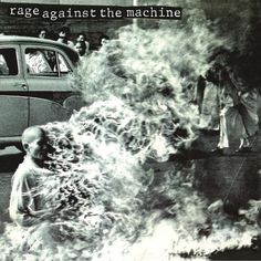 an old photo with people standing in front of a car and fire coming out of it