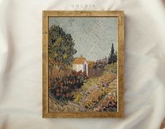 there is a painting hanging on the wall in front of a white sheet that says goldia