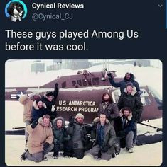 a group of people posing for a photo in front of an airplane with snow on the ground