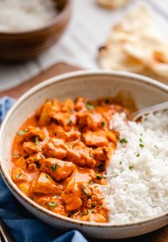 a bowl filled with rice and chicken curry