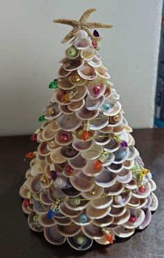 a christmas tree made out of seashells on a table