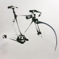 a black and white photo of a bicycle in the air with its front wheel still attached