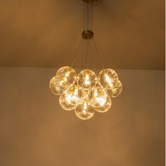 a chandelier hanging from the ceiling in a room