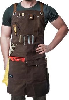 a man wearing an apron with tools on it