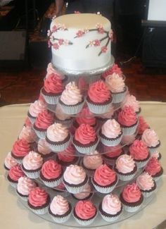 cupcakes are arranged in the shape of a tree