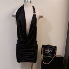 Rare Find! One-Of-A-Kind Head-Turning Statement Dress! Ultra-- Sexy Yet Chic Piece. It Has Jennifer Lopez’s Iconic Green Versace Dress Vibe! Comes In Gorgeous Shimmery Black. Designed With Deep V -Neck Cowl Halter Neckline, Lose Front Draping, Low Back Cut, Ruched Skirt, Unfinished Hem Style, And Beautiful Black Gem/ Rhinestone/Chain Embellishement. Made Of Lightweight, Stretchy 92% Polyester/8% Spandex For A Comfortable Fit. Can Be Worn As A Mini Dress Or As A Top. Approx: Length 30". True To S Green Versace Dress, Hollywood Dress, Black Gems, Versace Dress, Rhinestone Chain, Ruched Skirt, Statement Dress, Black Halter, Hem Style