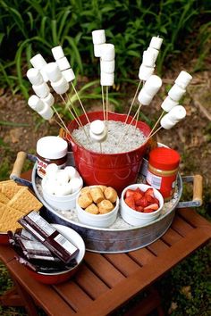 a bucket filled with marshmallows and other snacks