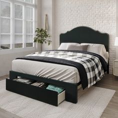 a bedroom with a bed, nightstands and window in it's center area