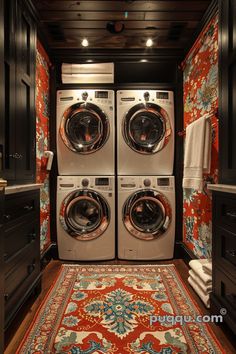 a washer and dryer in a room with floral wallpaper on the walls