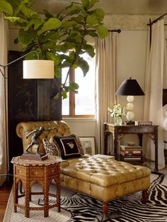 a living room filled with furniture and a tree