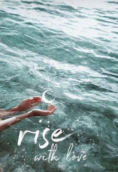 a person floating in the water with their hands out to each other that says rise with love