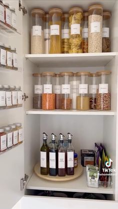 the pantry is stocked with all kinds of spices and condiments, including pasta