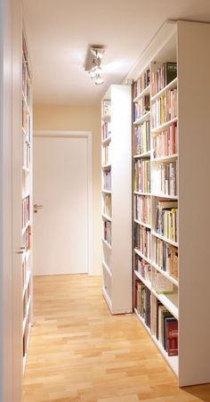 a long row of bookshelves filled with lots of books