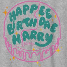 a birthday cake with the words happy birthday written in green, pink and yellow on it