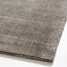 a close up view of a rug on a white surface with no one in it