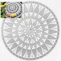 a white doily with yellow tulips in the middle and an image of a flower