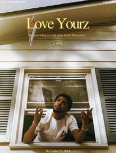 a man standing in front of a window with the words love yourz on it
