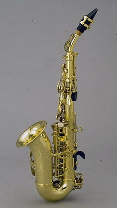 a gold saxophone sitting on top of a table