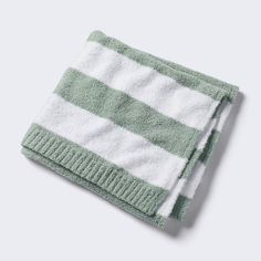 a green and white towel folded on top of each other