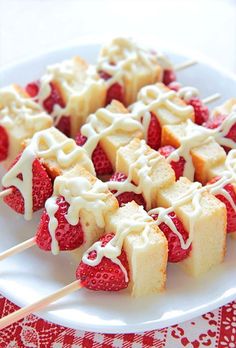 strawberry shortcakes with white icing and strawberries
