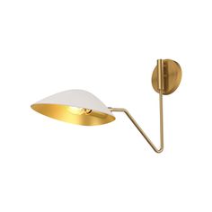 a wall light with a white shade on the side and a gold metal pole attached to it