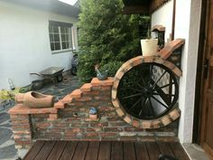 a brick wall with a wheel on it