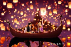 a man and woman in a boat floating on water with lanterns flying over the sky