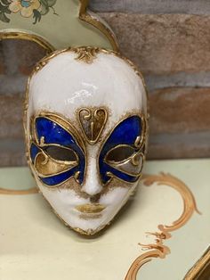 Original Venetian mask in papier-mâché made entirely by hand and decorated by hand with acrylic colors and gold leaf or silver leaf.Non-wearable size, can be used as a decorationMeasurements 12 x 18 cmAll our masks are handmade by our staff (me, my wife and our collaborators) in our atelier in Venice. The masks are all made of paperweight and are made using ancient techniques from the 1300sThey are decorated with acrylic colors, gold leaf, silver leaf, trifies, lace and Swarovski crystals so as Face Butterfly, Venitian Mask, Eros And Psyche, Historical Shoes, Venice Mask, Butterfly Mask, Lion Mask, Mask Painting, Butterfly Face