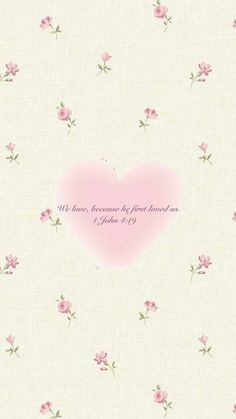 a pink heart on a white background with flowers