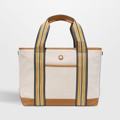 Hit the road, take to the skies or head to the beach with the handsome Cabana tote from Paravel. Crafted of creamy, textured canvas with a stain-repellant coating, the durable bag is accented with tan vegan leather details and straps striped jauntily in olive, mustard and white. Carry the tote to the office or pool, use as your personal item on flights or pack for overnight trips. The water-resistant blue satin lining finishes the medium bag with a secret touch of luxury.   • Durable, stain-repe Secret Touch, Shandy, Medium Bag, Cool Glasses, Textured Canvas, Stripes Texture, Hit The Road, Luggage Accessories, Blue Satin