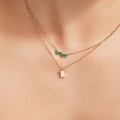 Inspired by nature's first blooms, ethical emeralds huddle together, reminiscent of flower petals blossoming on the chest. Cast with high-end recycled gold, the minimalist faceted chain adds an extra touch of brilliance to this playful necklace. Accent stones: Emeralds, 0.20+ ctw Chain width: 1 mm approx. Chain length: 16 / 18 in. Chain type: Diamond-cut trace chain Closure: Lobster clasp Ring Into Necklace, Yellow Stone Pendant, Emerald Chain, Simple Necklace Designs, Emerald Pendant Necklace, Emerald Necklace Pendant, High End Jewelry, Simple Diamonds, Baby Jewelry