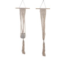two white macrame hangings with tassels