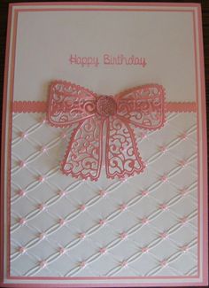 a birthday card with a pink bow on it