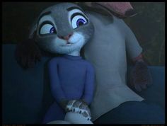 an animated character is sitting next to a stuffed animal in the shape of a rabbit