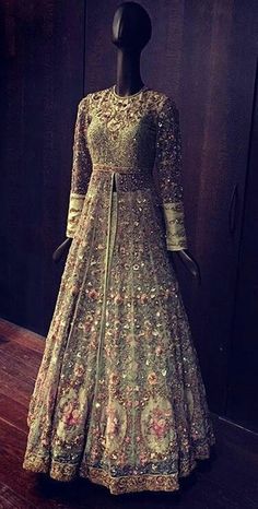 a mannequin is dressed in an elaborate dress