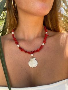 Handmade red seashell necklace. ❤️ The necklace is made from an ethically handpicked seashell from local beaches in Greece. 🌊🐚 Made with red coral beads, golden beads, freshwater pearls and a seashell pendant. 🐚 Chain length: 49cm  Pendant length: 4cm Coral Beaded Necklace, Necklace Photoshoot Ideas, Seashells Accessories, Red Seashell, Beaded Gold Necklace, Seashell Necklaces, Beaches In Greece, Beachy Necklace, Large Bead Necklace