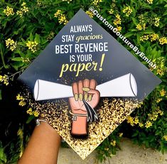 someone is holding up a graduation cap that says, stay gracious's best revenge is your paper